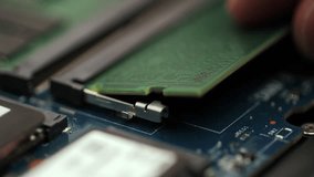 Installing DDR5 RAM module into laptop motherboard slot - Powered by Shutterstock - Get 15% off with code: PIKWIZARD15