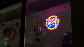 Bright evening atmosphere. Colorful neon sign illuminates downtown shop ambiance - Powered by Shutterstock - Get 15% off with code: PIKWIZARD15