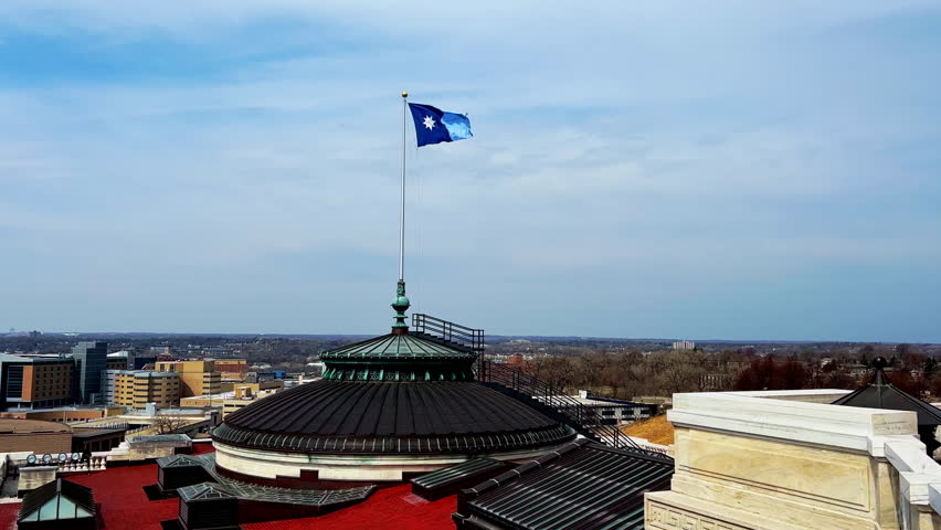 New Minnesota flag at roof in saint Paul on a summer day