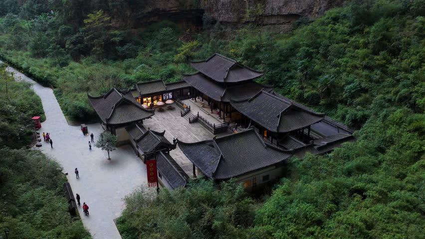 Tianfu Official Station at the bottom of a sinkhole within the Three Natural Bridges site in the Wulong Karst National Geology Park In China. - aerial shot