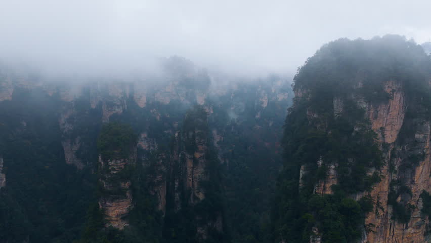 Misty Landscape Of Zhangjiajie National Forest Park After The Rain In Hunan, China. - aerial shot