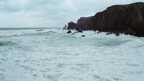 Drone shot of rocky sea stacks in the midst of an Atlantic storm in winter. - Powered by Shutterstock - Get 15% off with code: PIKWIZARD15