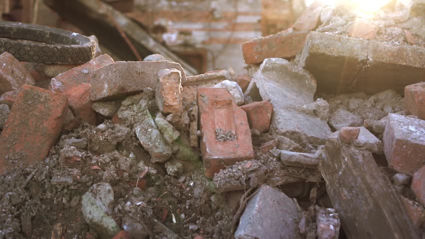Scene of destruction after a fire, showing charred remains, smoke, and debris, highlighting aftermath, disaster, and urban devastation.