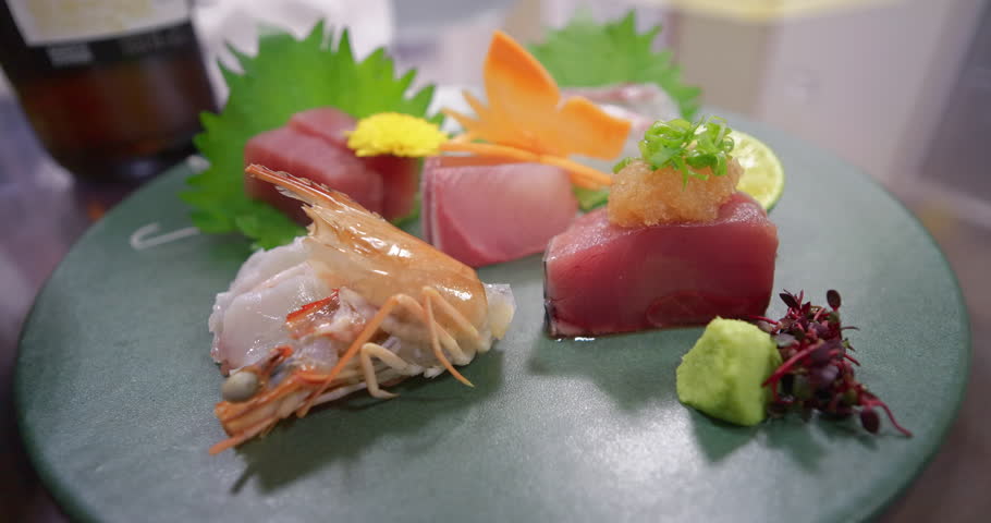 Elegant sashimi and Sushi Plate with Tuna, Shrimp, and Wasabi