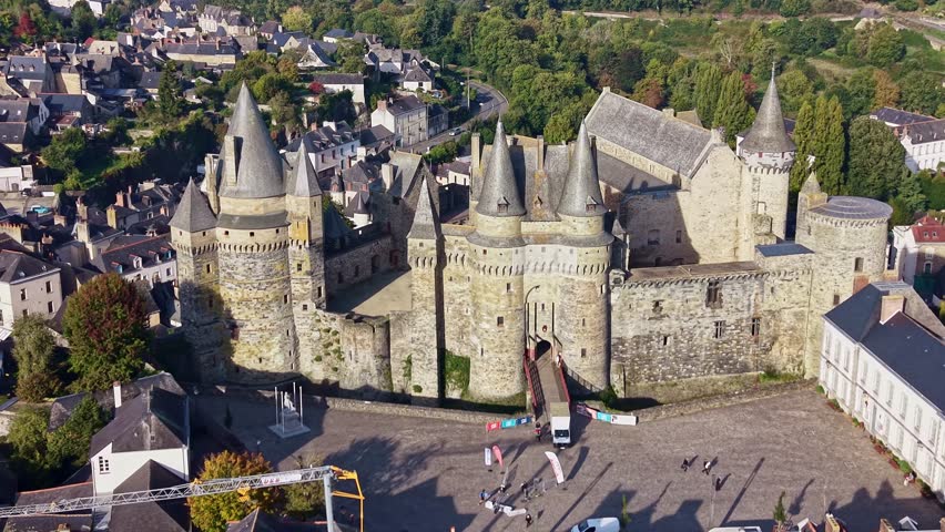 Medieval Château de Vitré, castle integrated into the historic town of Vitré, Brittany, France. Aerial drone backward