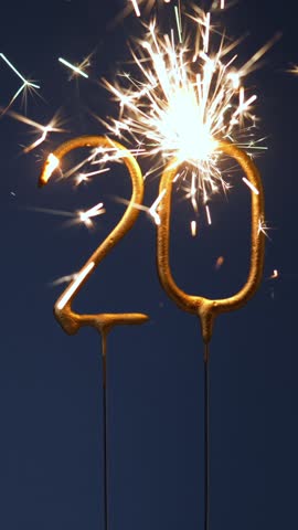 20th anniversary festive vertical footage made with Bengal fires forming the number Twenty