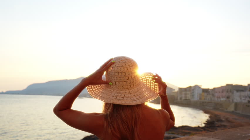 Young Woman Looking at the Sea During Solo Travel in Sicily Italy Scenic Lifestyle
