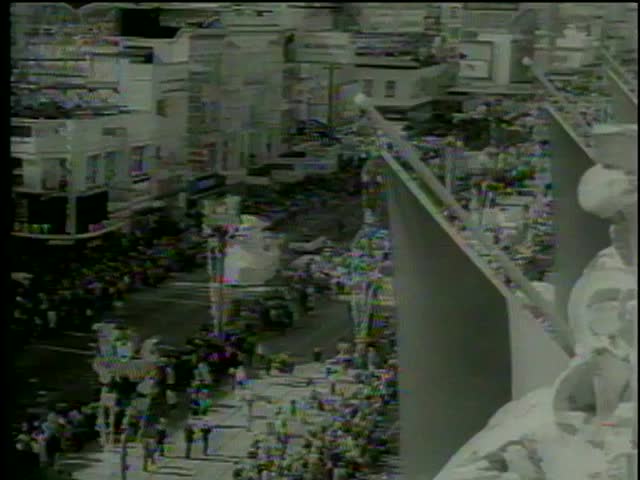 People celebrate Mardi Gras Parade in New Orleans circa 1964-MGM PICTURES, UNIVERSAL-INTERNATIONAL NEWSREEL, USA, filmed in 1964  