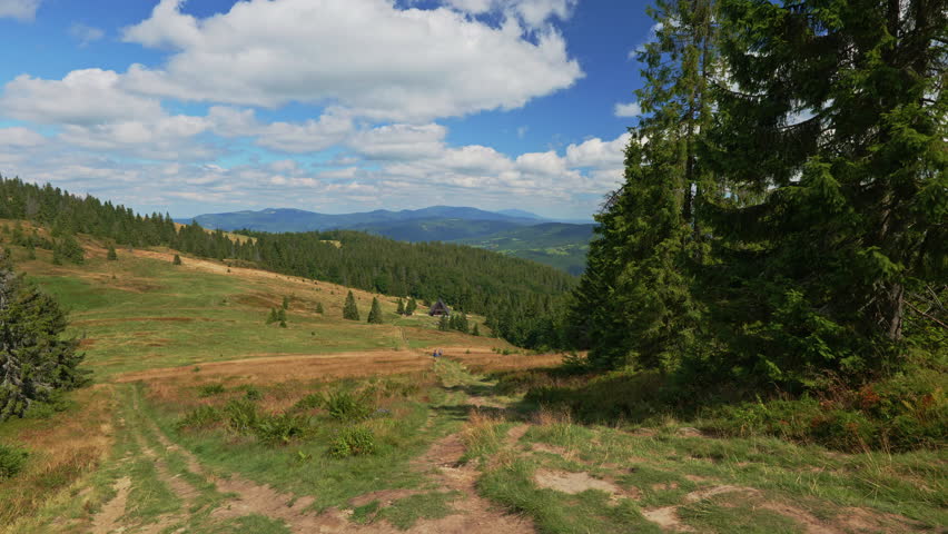 A view of the Rycerzowa meadows. A panorama of the Żywiec Beskids. The mountain shelter on Rycerzowa. Summer in the mountains. Poland. Mountain tourism.
