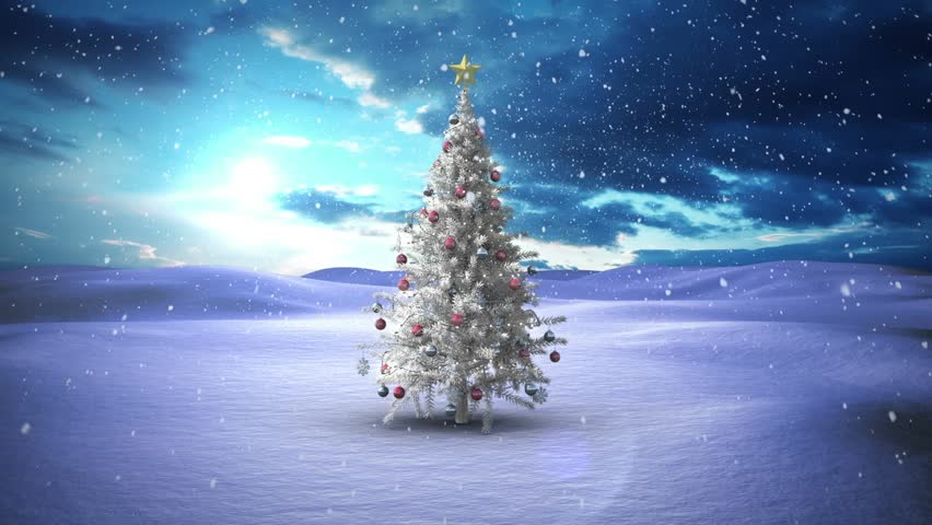Animation of green leaves and snow falling over decorated white christmas tree on winter landscape. Christmas festivity and celebration concept