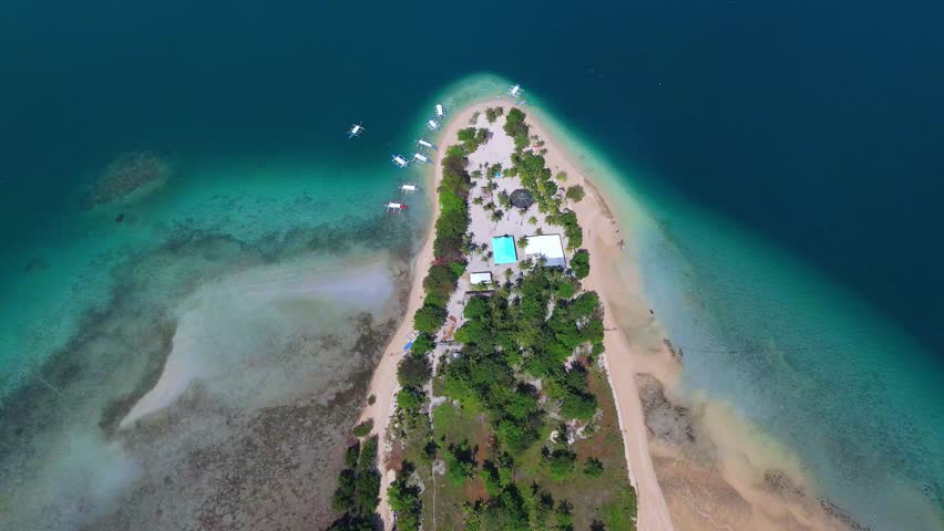 Cinematic drone panorama of tropical Cowrie island paradise in the Philippines, Palawan. aerial view of beauty of Puerto Princesa from above