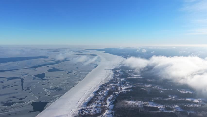 Aerial view of a frozen sea bay in winter, conveying solitude and peace