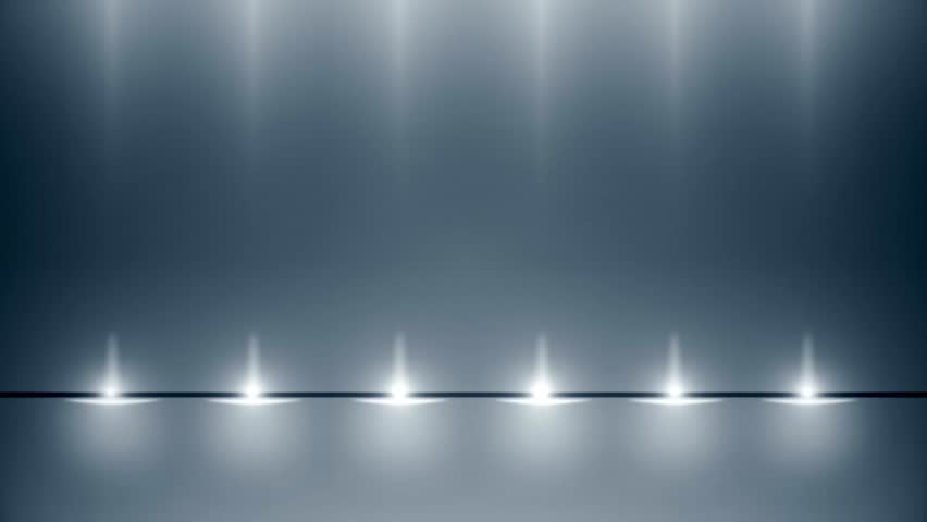 This video features a digital illustration of a studio background. The visual captures a dark blue-grey space with white spotlights directed from the upper and lower edges toward the center. The composition illustrates a symmetrical lighting arrangement and empty stage floor, documenting virtual set design and volumetric light effects in a high-resolution 4K format for presentations and events.