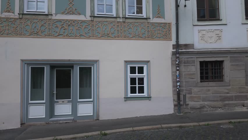 The house of August Friedrich Ferdinand von Kotzebue in Weimar, Germany. Home of the famous German dramatist, playwright and novelist of the Goethe era behind a fresh green vine branch.