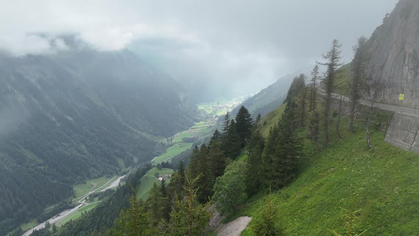 Foggy Klausenpass pass road drone video at Unterschächen, Schächental valley, canton Uri, Swiss Alps Switzerland