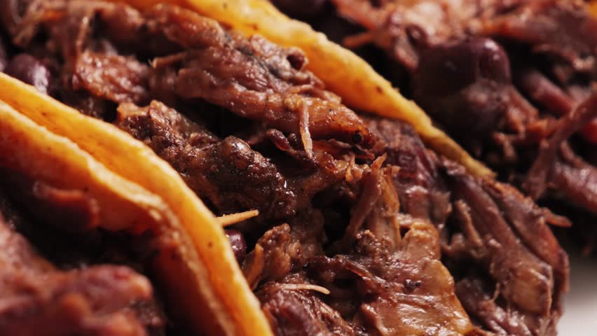 Authentic Mexican tacos filled with cochinita pibil, minced beef with sauce. High quality 4k footage