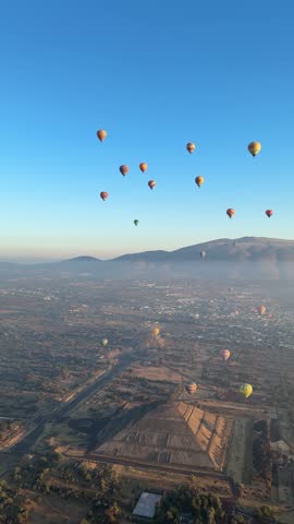 Panoramic aerial view of Mexico Teotihuacan pyramids. Hot air balloons flying over the Mexican Highlands near Mexico City.