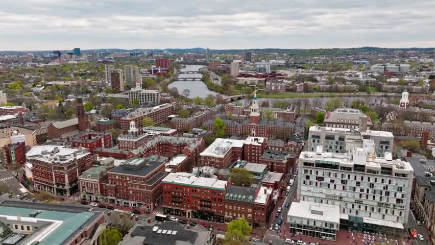 Aerial view of Harvard University campus and the Charles River in Cambridge, MA, perfect for education, landmarks, and cityscape footage.