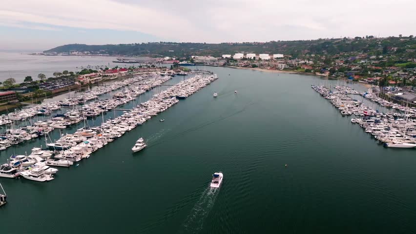 60FPS Static Drone Footage of Boat Exiting the Harbor at Shelter Island, in San Diego, California, USA