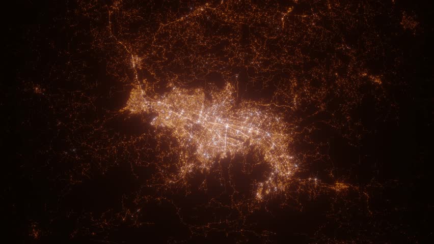 Medellin (Colombia) top view at night. Top view on modern city with street lights and glow effect. Camera is zooming in, rotating clockwise. Vertical video. The north is on the left side