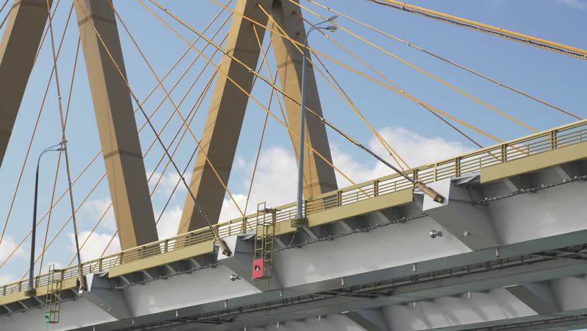 Massive sculptural pylon shaped like letter M rises with taut steel cables. Clean geometric lines emphasize modern engineering elegance