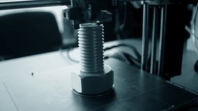 3D printer printing an object. A 3D printer printing an object from molten plastic on a work surface of 3D printer. A 3D printer creating a model. Molten plastic flowing out of an extruder close-up. - Powered by Shutterstock - Get 15% off with code: PIKWIZARD15