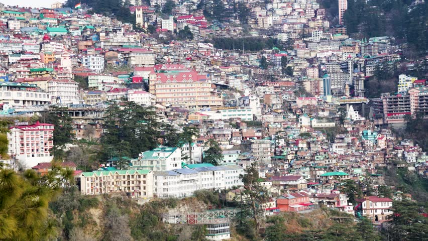 scenic hill station cityscape with layered houses and evergreen trees video is taken at shimla himachal pradesh india.