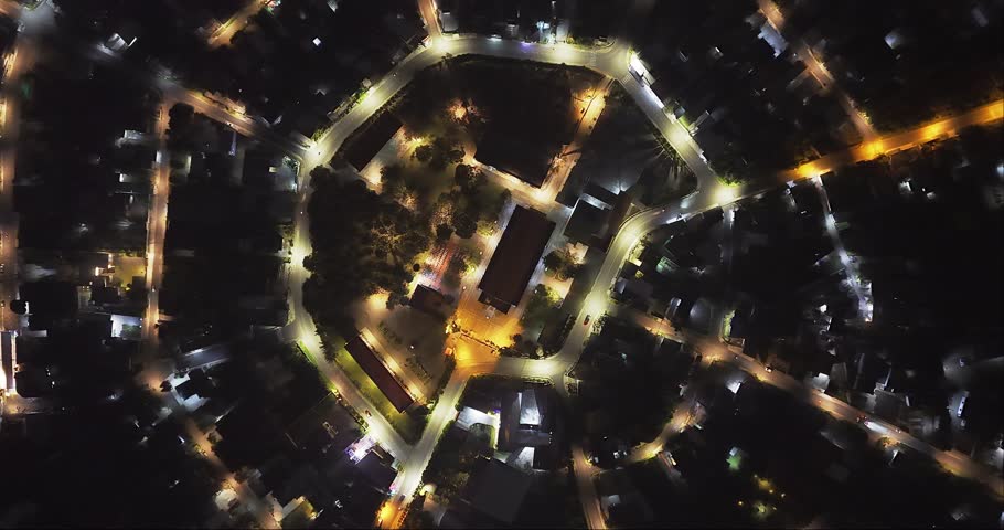 Aerial view of Residential area in Bao Loc city, Vietnam at night with the center being the church and the streets divided like abstract Chinese bagua