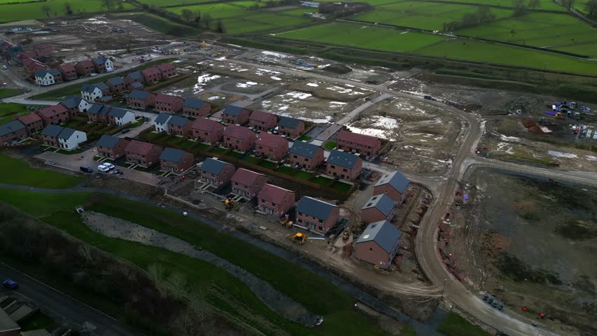 Housing development builds progress over time in Ripon with vibrant red-brick homes and dynamic construction activity