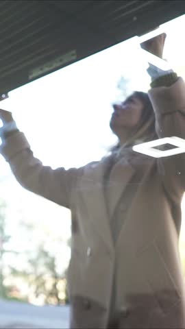 Female Business Owner of Local Store opening garage storefront