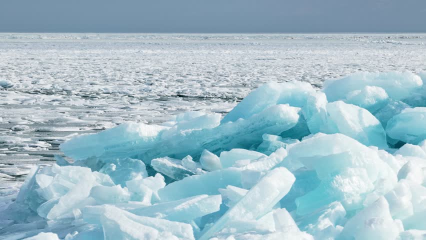 Hummocks on the Kapchagai reservoir. Ice blocks covering the lake. Winter time. The view from the drone.