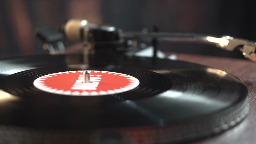 Starting Playback of Vinyl Record With New Music on 1980's Turntable