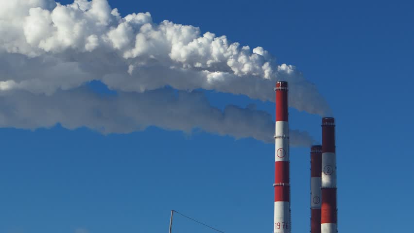Chimneys of a thermal power plant.  Timelapse, accelerated shooting. problems with thermal energy and electricity.