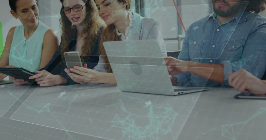 A group of executives using various digital devices in a meeting. Global business and data processing concept digitally generated video.