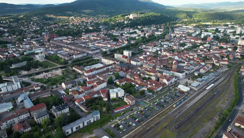 A panoramic aerial view around the old town of the city Saint-Dié-des-Vosges in France on a sunny spring afternoon