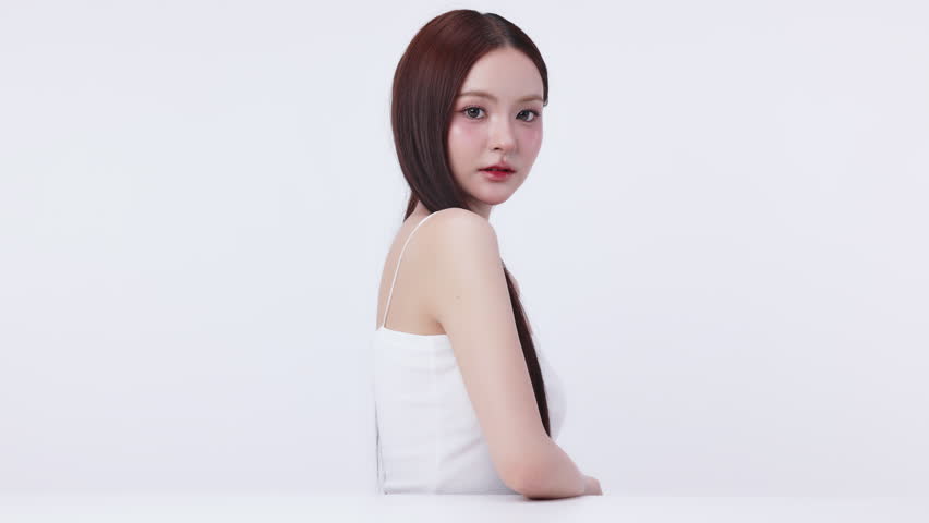 Slow motion portrait beautiful young Asian woman with K beauty style makeup and perfect skin. Facial and skin care concept for commercial advertising.