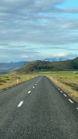 Driving on Iceland Road with Mountains Landscape