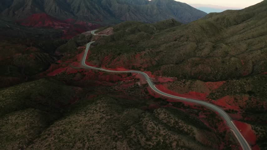 Sweeping aerial of serpentine road through rugged Cuesta de Miranda terrain, Cuesta De Miranda La Rioja Argentina
