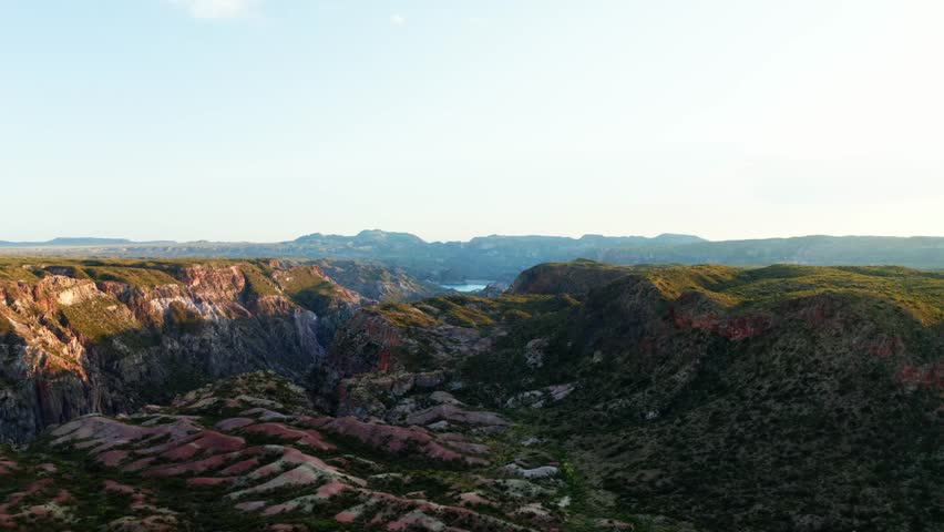 Aerial dolly of expansive canyon landscape with layered cliffs and valleys, Canon Del Atuel, Mendoza Argentina