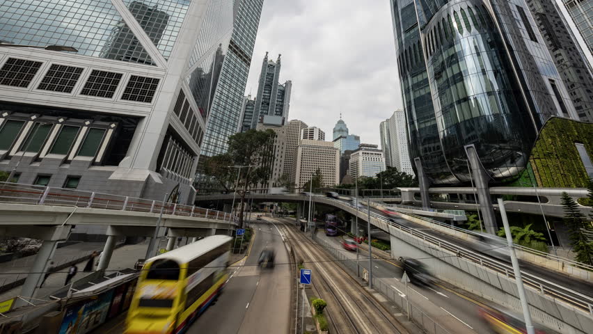 Amazing Hong kong financial district skyline from the street level with rushing traffic