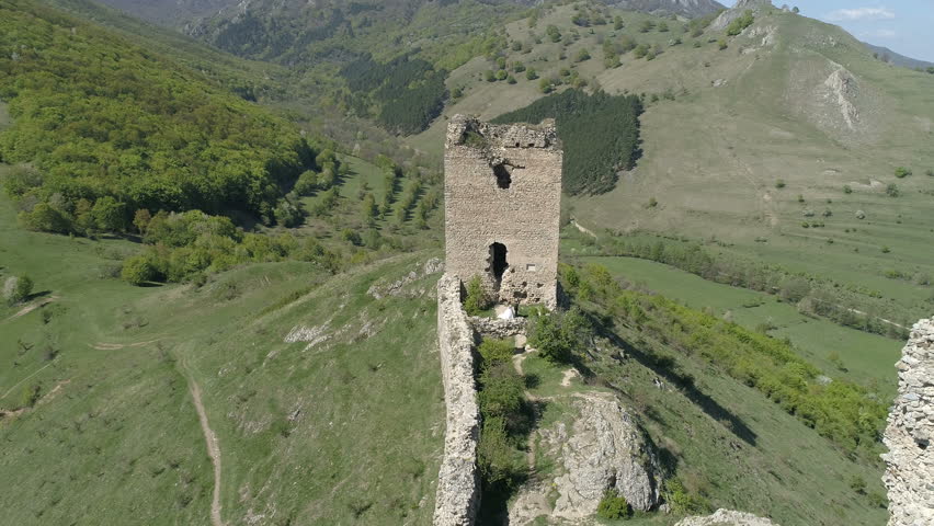 Aerial view of a fortress between the hills