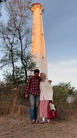 indonesian young couple enjoying at Parangtritis Beach,Yogyakarta