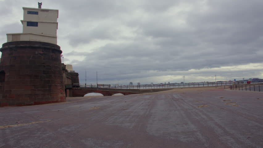 Wide panning shot of Fort Perch rock on the river Mersey. at New Brighton beach.