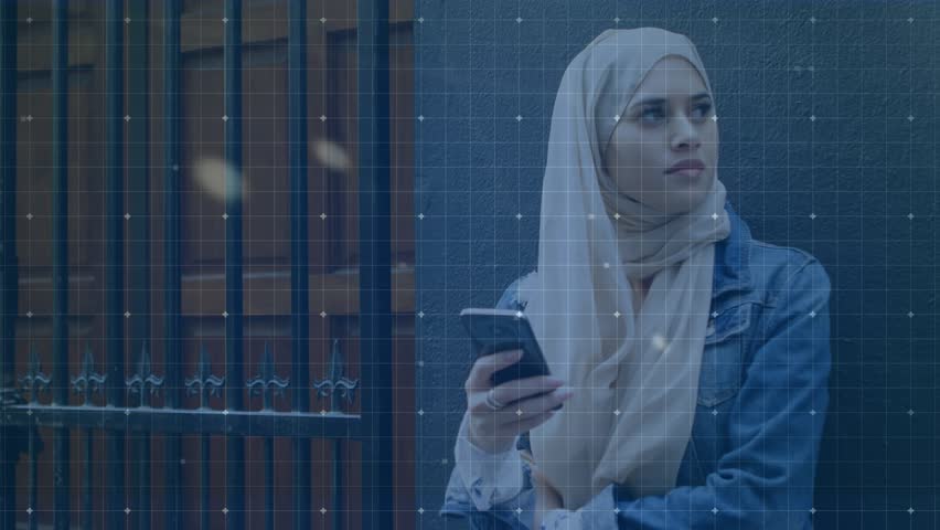 Animation of data processing over muslim women using smartphone. Global connections, finances, data processing and digital interface concept digitally generated video.