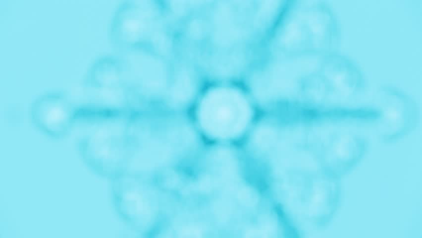 Snowflake ice crystal under microscope brightfield with blue filter