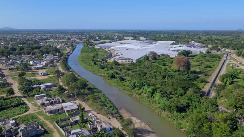 CODEVI industrial park and factory buildings in the free trade zone on the border in Dajabón, Dominican Republic. Aerial forward