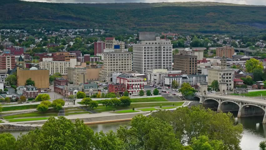 Cityscape of Harrisburg with the scenic Susquehanna River flowing in the foreground and downtown skyline rising beyond.