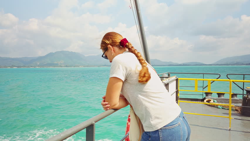 Woman Leaning On Ferry Railing Watching Open Sea Creating Calm Travel And Maritime Lifestyle Scene.