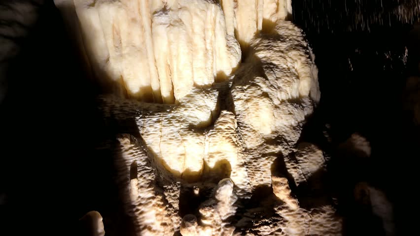 Illuminated Underground Lake Cave With Stalactites, Stalagmites and Reflective Cave Pool in Limestone Cavern, Western Australia