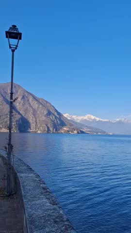 a beautiful alpine lake with snow-capped mountains in the background